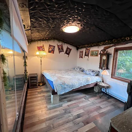 Black House In The Forest With Hot Tube And Theater For Movies